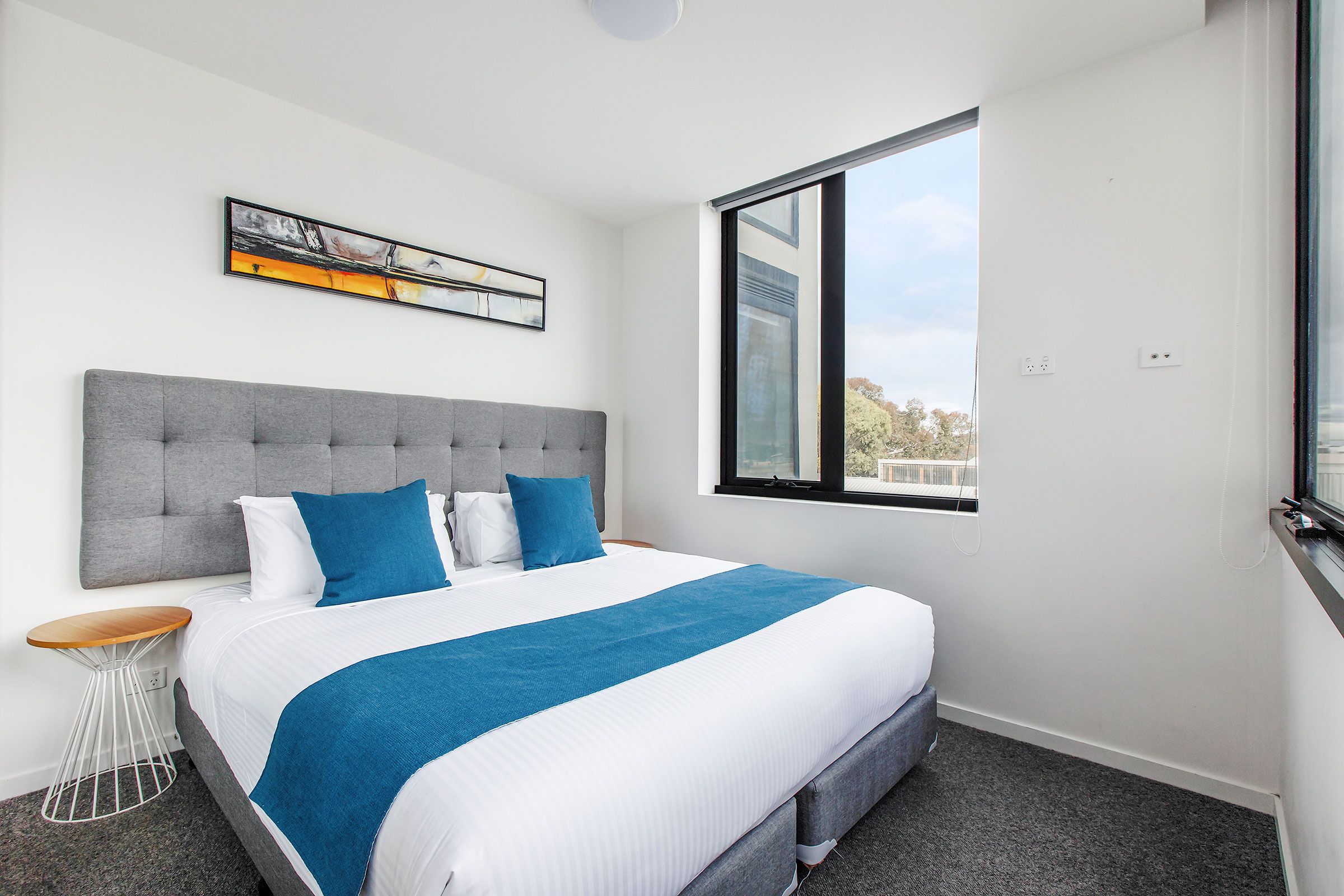 2 Bedroom Deluxe — king bedroom with window