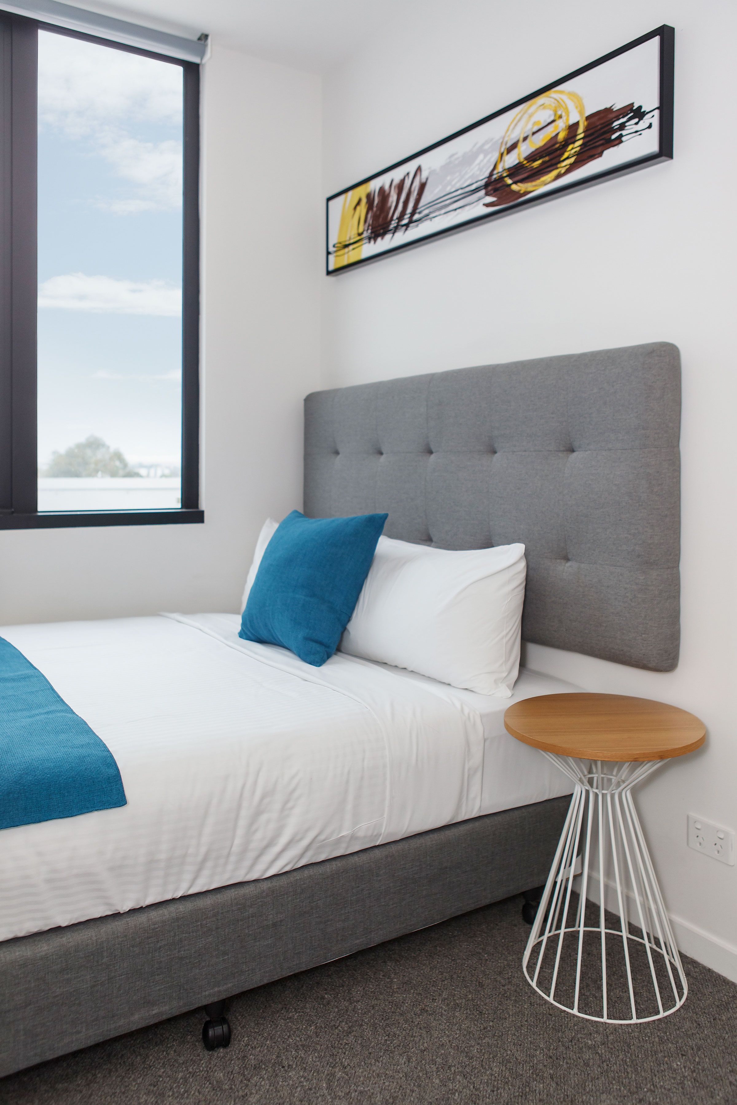 Premium 2 Bedroom — single bedroom with art